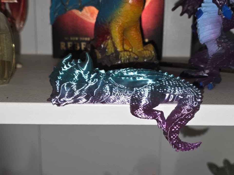 Teal and purple color-shifting 3D printed sleeping dragon